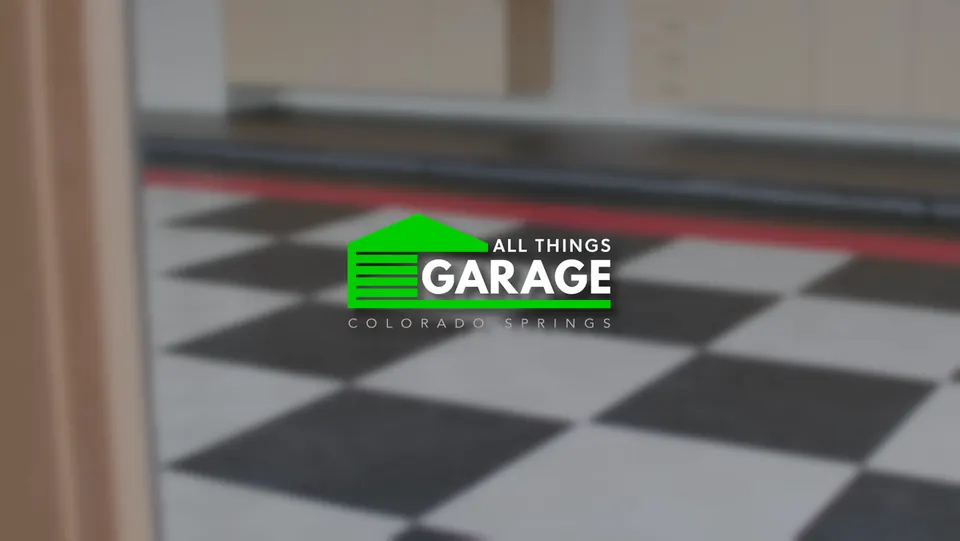 All Things Garage logo on a checkered garage floor