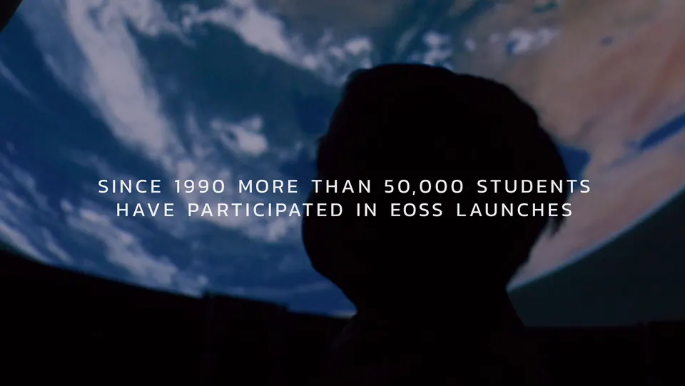 Silhouette against the sky with text about 50,000 students in EOSS launches