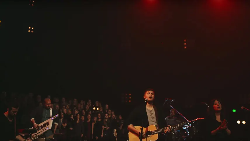 New Life Worship leading worship on a dark stage