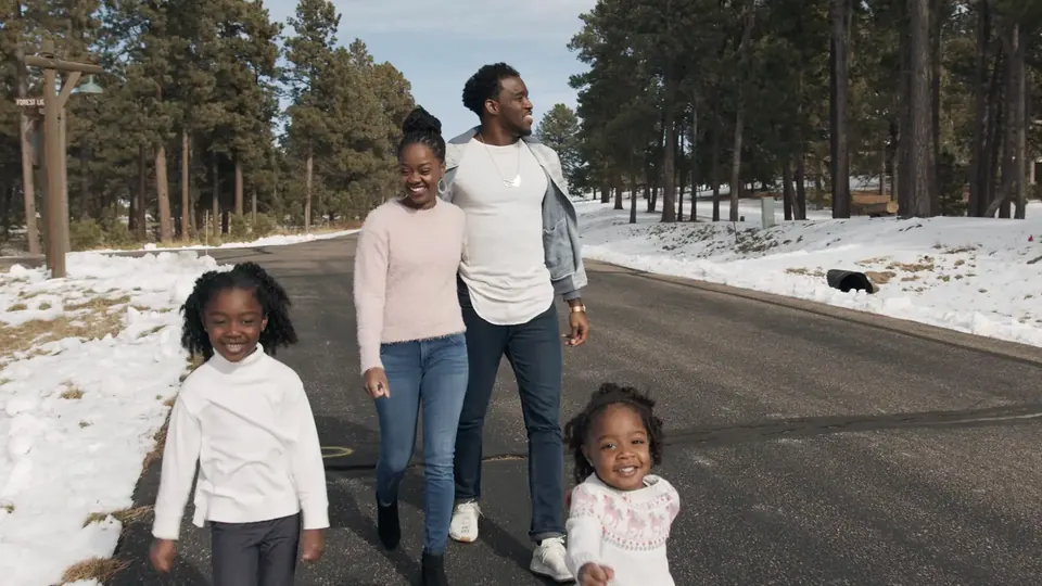 Family walking with their kids down a snowy road, from the Zeal Church launch video
